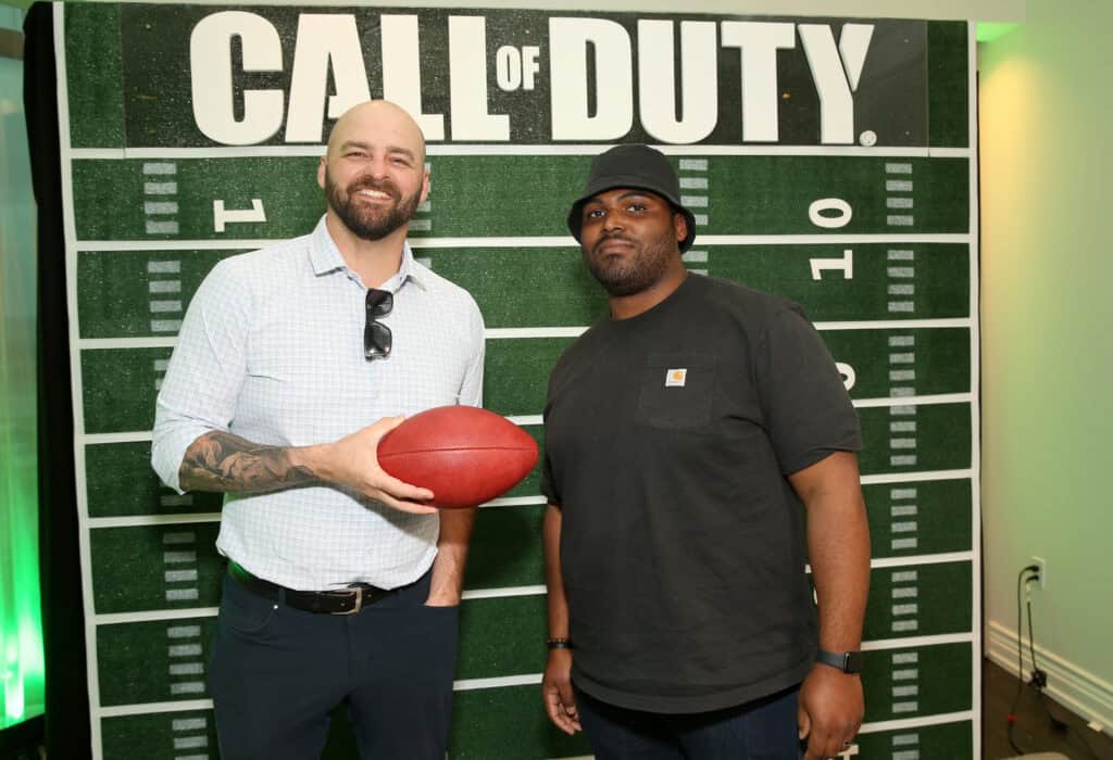 LAS VEGAS, NEVADA - APRIL 27: (L-R) Mike Golic Jr. and Brandon Newman attend Call of Duty: Modern Warfare II event at the 2022 NFL Draft on April 27, 2022 in Las Vegas, Nevada.