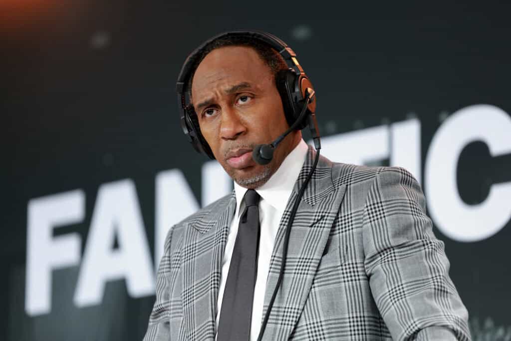 NEW YORK, NEW YORK - JULY 17: Stephen A. Smith speaks on stage as Stephen A. Smith and Christopher Russo host SiriusXM shows live from Fanatics Fest at Javits Center on July 17, 2026 in New York City.