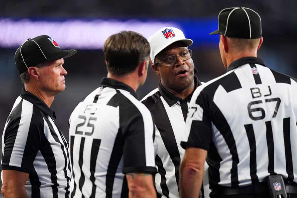 ARLINGTON, TEXAS - SEPTEMBER 22: Referee Ronald Torbert #62 discusses a call with his crew during the second quarter of a game between the Dallas Cowboys and the Baltimore Ravens at AT&T Stadium on September 22, 2024 in Arlington, Texas.