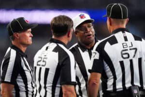 ARLINGTON, TEXAS - SEPTEMBER 22: Referee Ronald Torbert #62 discusses a call with his crew during the second quarter of a game between the Dallas Cowboys and the Baltimore Ravens at AT&T Stadium on September 22, 2024 in Arlington, Texas.