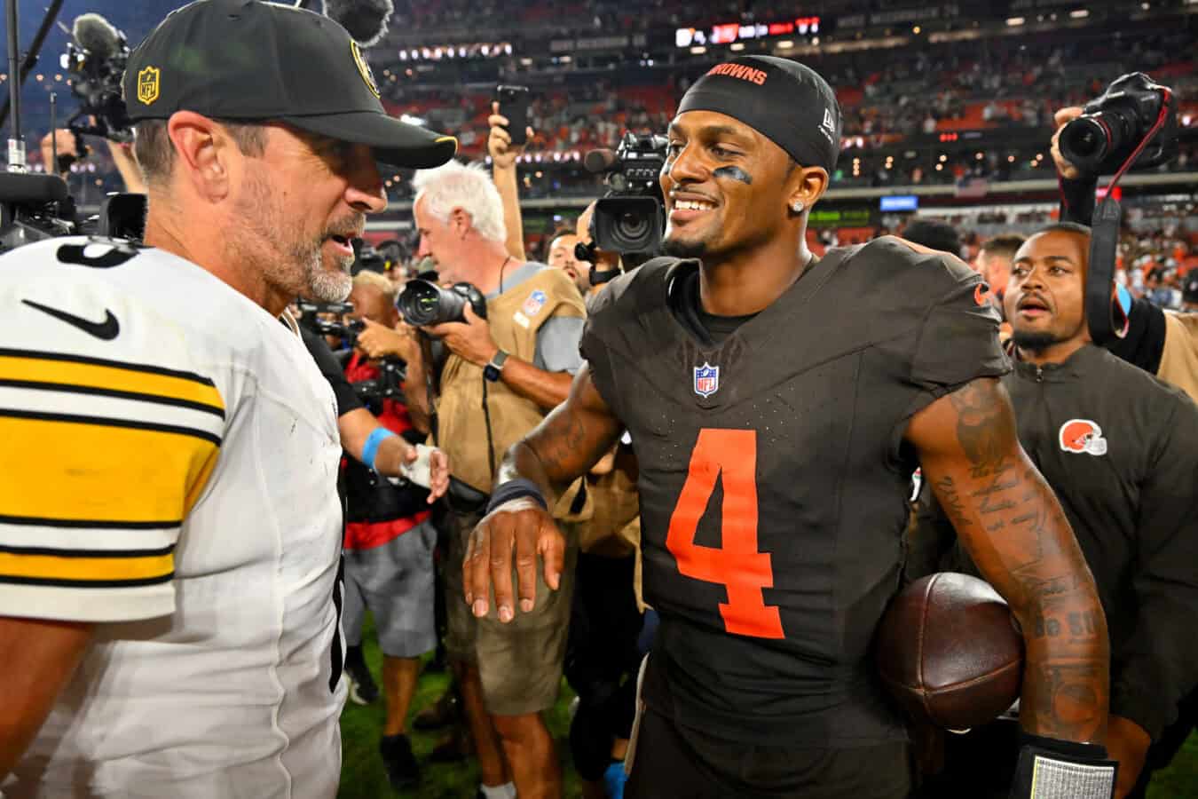 CLEVELAND, OHIO - OCTOBER 01: Quarterback Aaron Rodgers #8 of the Pittsburgh Steelers talks to quarterback Deshaun Watson #4 of the Cleveland Browns after the game at Huntington Bank Field on October 01, 2026 in Cleveland, Ohio.