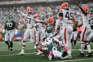 EAST RUTHERFORD, NEW JERSEY - OCTOBER 11: Ronnie Hickman #33 of the Cleveland Browns recovers a fumble against Braelon Allen #0 of the New York Jets during the third quarter of the game at MetLife Stadium on October 11, 2026 in East Rutherford, New Jersey.