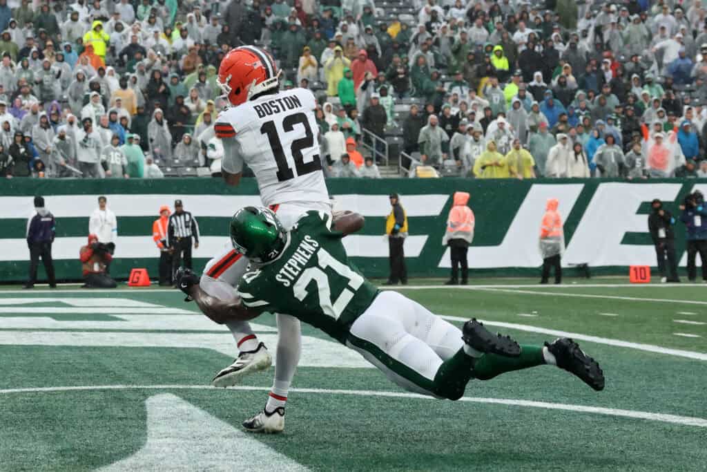 EAST RUTHERFORD, NEW JERSEY - OCTOBER 11: Denzel Boston #12 of the Cleveland Browns makes a catch for a touchdown during the fourth quarter of the game against Brandon Stephens #21 of the New York Jets at MetLife Stadium on October 11, 2026 in East Rutherford, New Jersey.