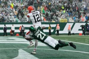 EAST RUTHERFORD, NEW JERSEY - OCTOBER 11: Denzel Boston #12 of the Cleveland Browns makes a catch for a touchdown during the fourth quarter of the game against Brandon Stephens #21 of the New York Jets at MetLife Stadium on October 11, 2026 in East Rutherford, New Jersey.