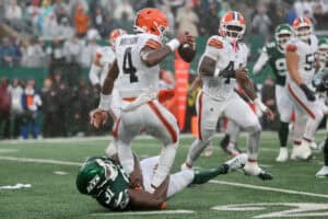 EAST RUTHERFORD, NEW JERSEY - OCTOBER 11: Deshaun Watson #4 of the Cleveland Browns is tackled by David Bailey #31 of the New York Jets during the fourth quarter of the game at MetLife Stadium on October 11, 2026 in East Rutherford, New Jersey. (