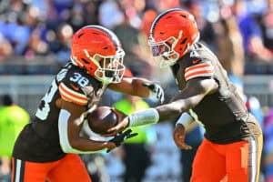 CLEVELAND, OHIO - OCTOBER 18: Deshaun Watson #4 of the Cleveland Browns hands the ball to Jaleel McLaughlin #38 against the Baltimore Ravens during the fourth quarter of the game at Huntington Bank Field on October 18, 2026 in Cleveland, Ohio.