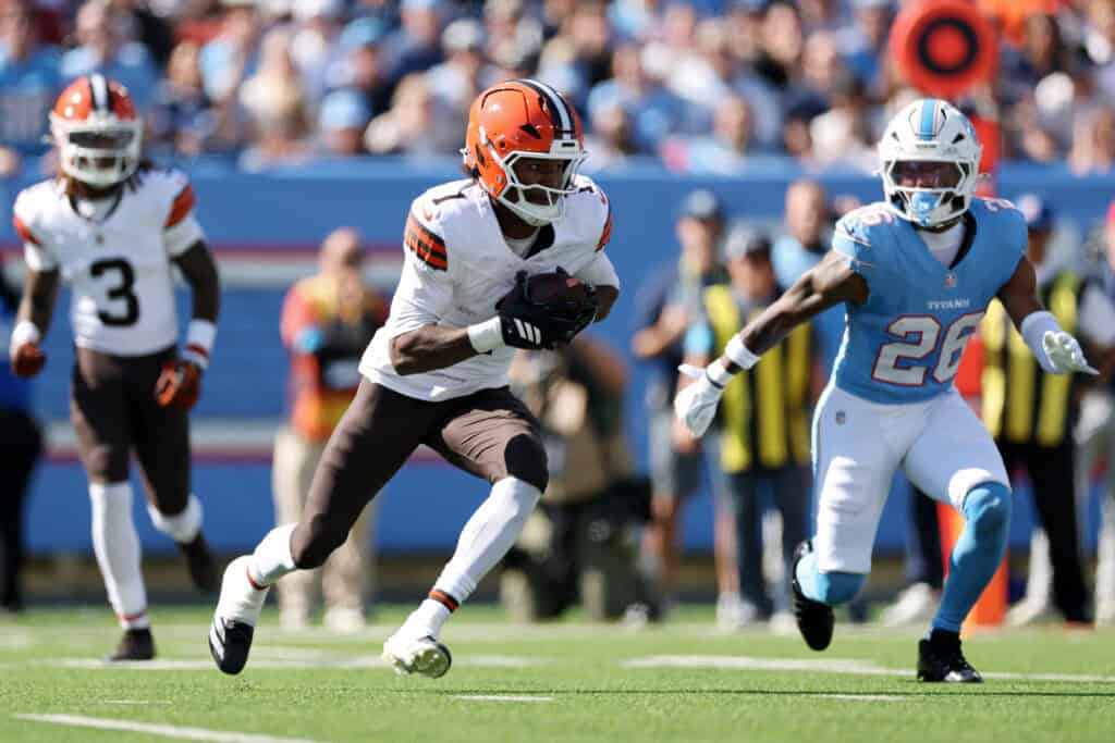 NASHVILLE, TENNESSEE - OCTOBER 25: Kc Concepcion #1 of the Cleveland Browns runs the ball after a catch against Marcus Harris #26 of the Tennessee Titans during the first quarter at Nissan Stadium on October 25, 2026 in Nashville, Tennessee.