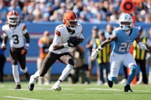 NASHVILLE, TENNESSEE - OCTOBER 25: Kc Concepcion #1 of the Cleveland Browns runs the ball after a catch against Marcus Harris #26 of the Tennessee Titans during the first quarter at Nissan Stadium on October 25, 2026 in Nashville, Tennessee.