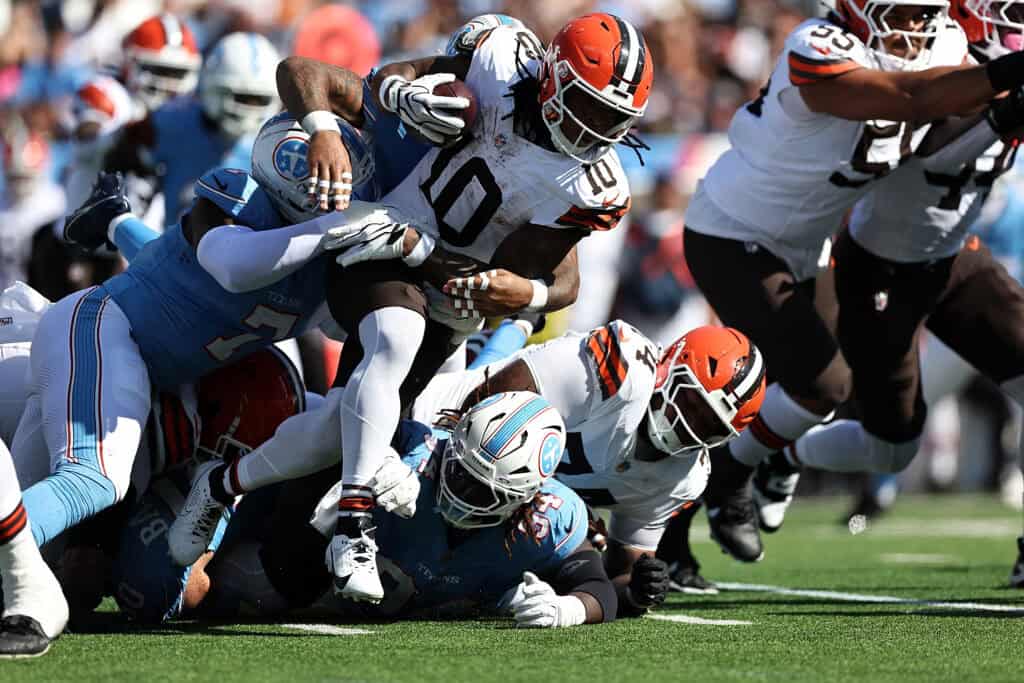 NASHVILLE, TENNESSEE - OCTOBER 25: Quinshon Judkins #10 of the Cleveland Browns carries the ball against Oluwafemi Oladejo #7 of the Tennessee Titans during the first half at Nissan Stadium on October 25, 2026 in Nashville, Tennessee.