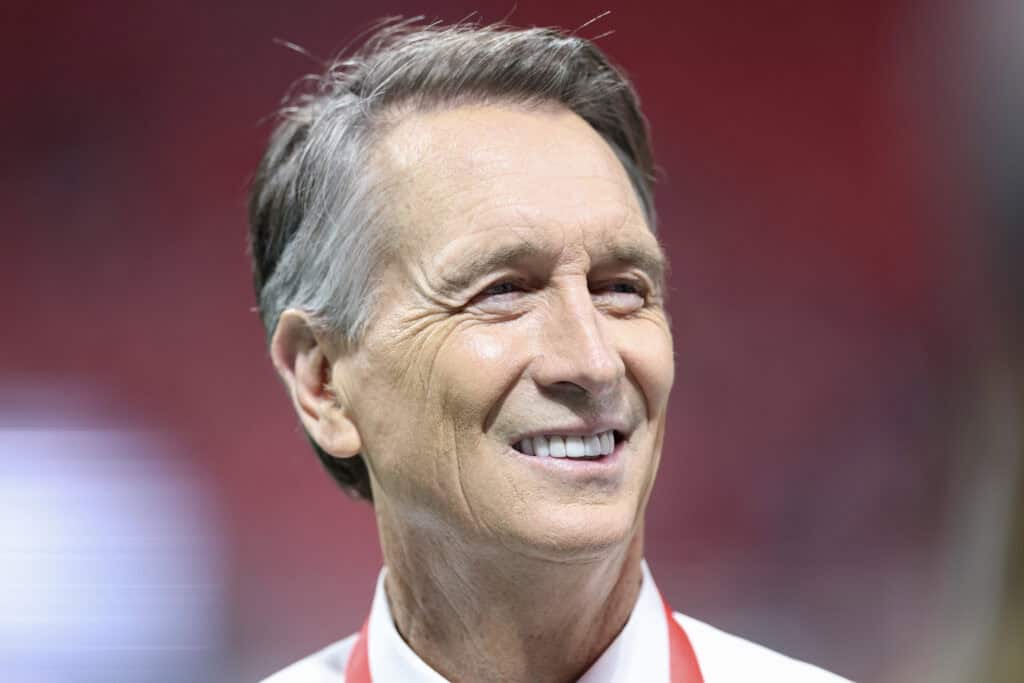 ATLANTA, GEORGIA - OCTOBER 11: NBC's Cris Collinsworth looks on before a game between the Atlanta Falcons and the Baltimore Ravens at Mercedes-Benz Stadium on October 11, 2026 in Atlanta, Georgia.