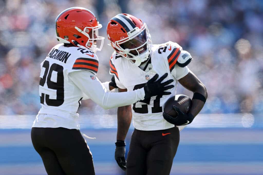 NASHVILLE, TENNESSEE - OCTOBER 25: Denzel Ward #21 of the Cleveland Browns celebrates an interception with Mekhi Blackmon #29 of the Cleveland Browns during the second quarter at Nissan Stadium on October 25, 2026 in Nashville, Tennessee.